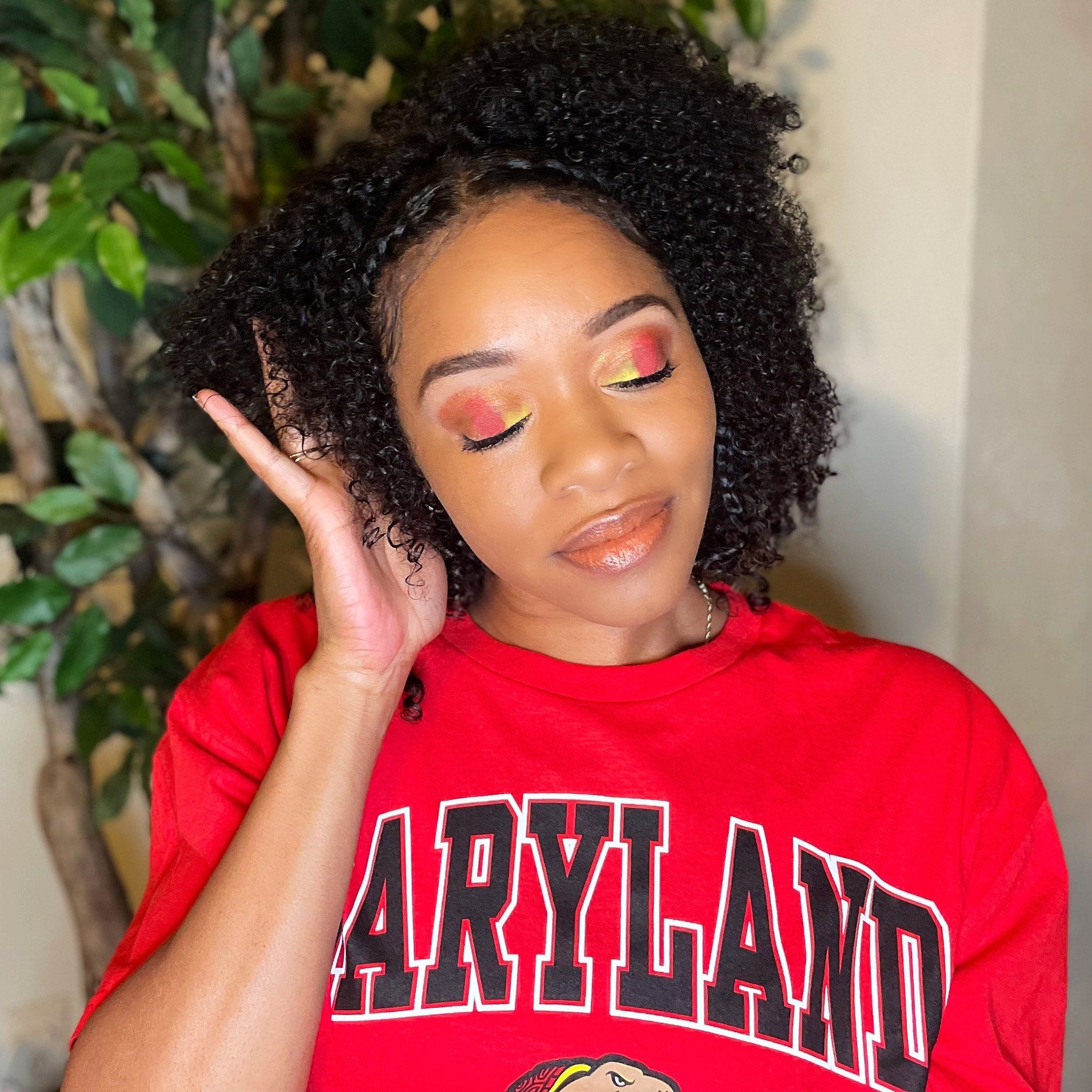 Close-up of Maryland University Eye Shadow palette showing shimmering bronze and plum shades with smooth powder texture