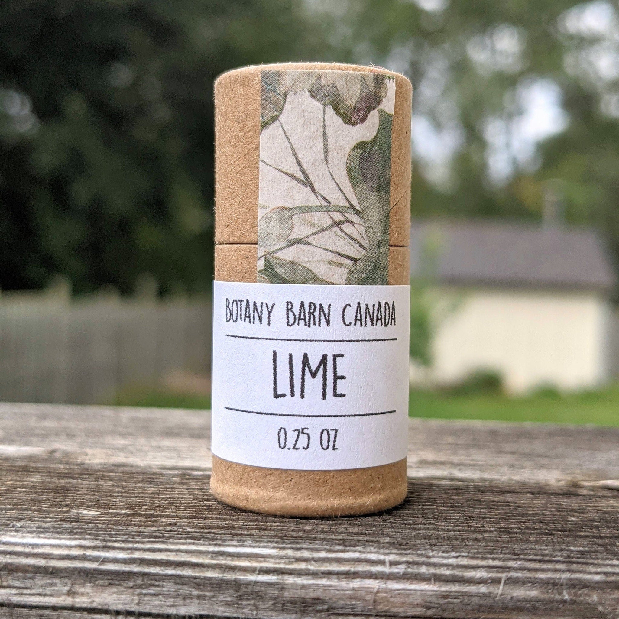 Lime product Botany Barn Canada, brown cardboard tube with white label, floral pattern on top section