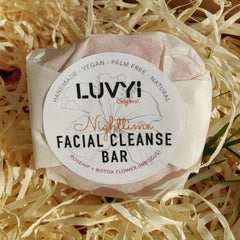 Facial Cleanser Bar wrapped in white paper, pink bar, Luvyi Nighttime label