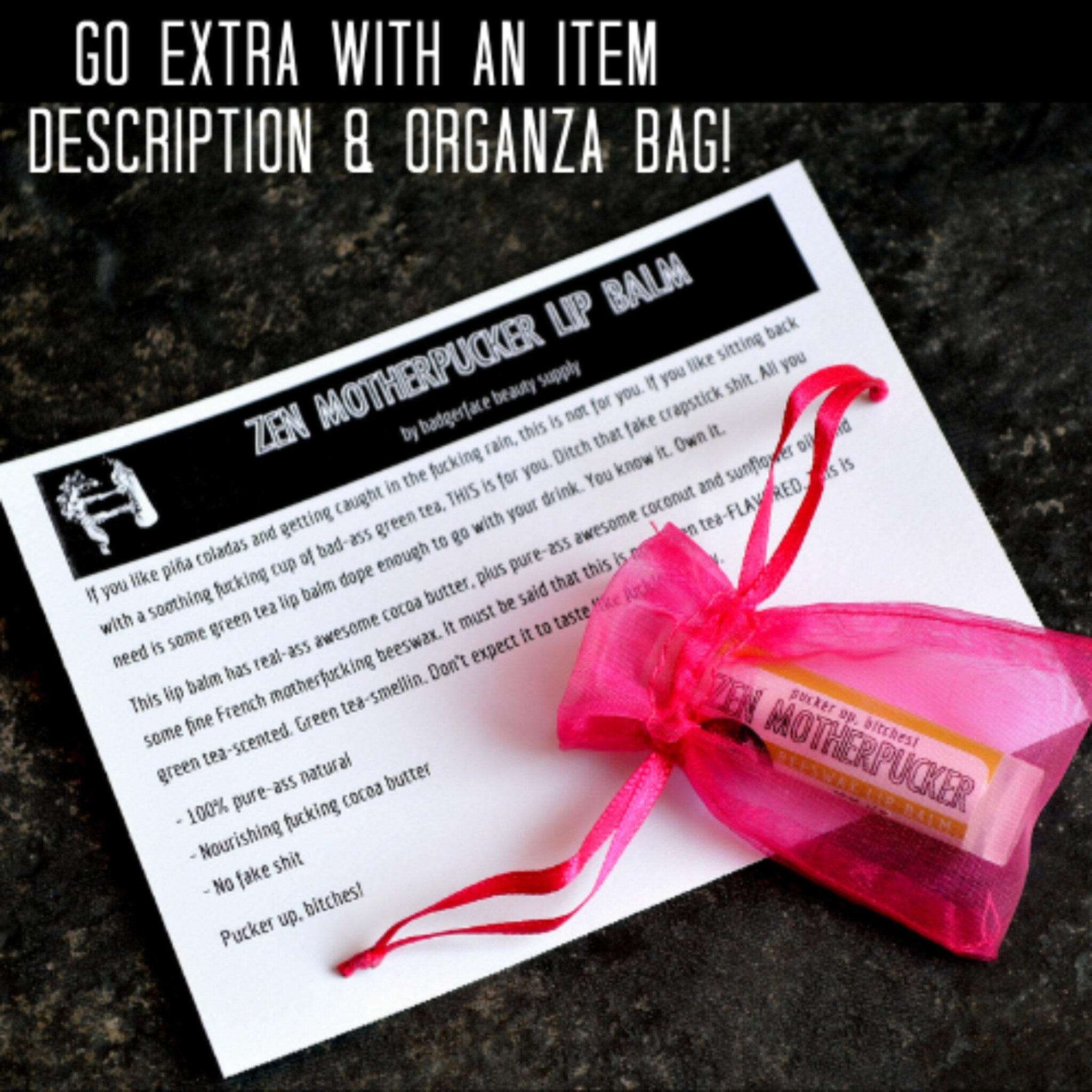 Lip balm in pink organza bag with red ribbon, Zen Motherpucker brand text on product and bag