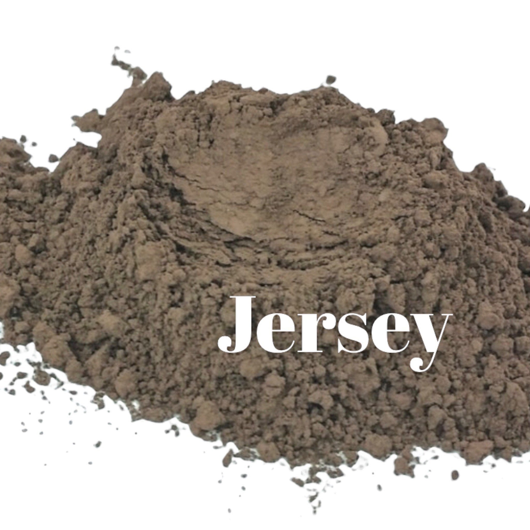 Two matte mineral eyeshadow pans in taupe and light reddish brown shades with vegan organic labeling