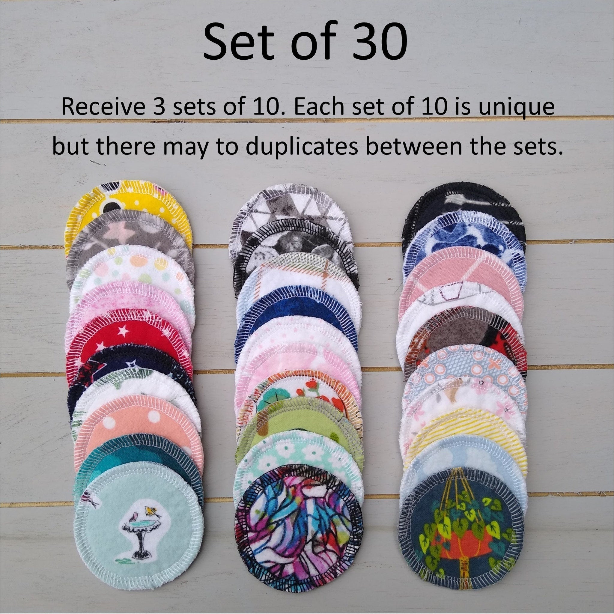 Reusable facial rounds in assorted colors and patterns, with stitched edges, stacked in rows