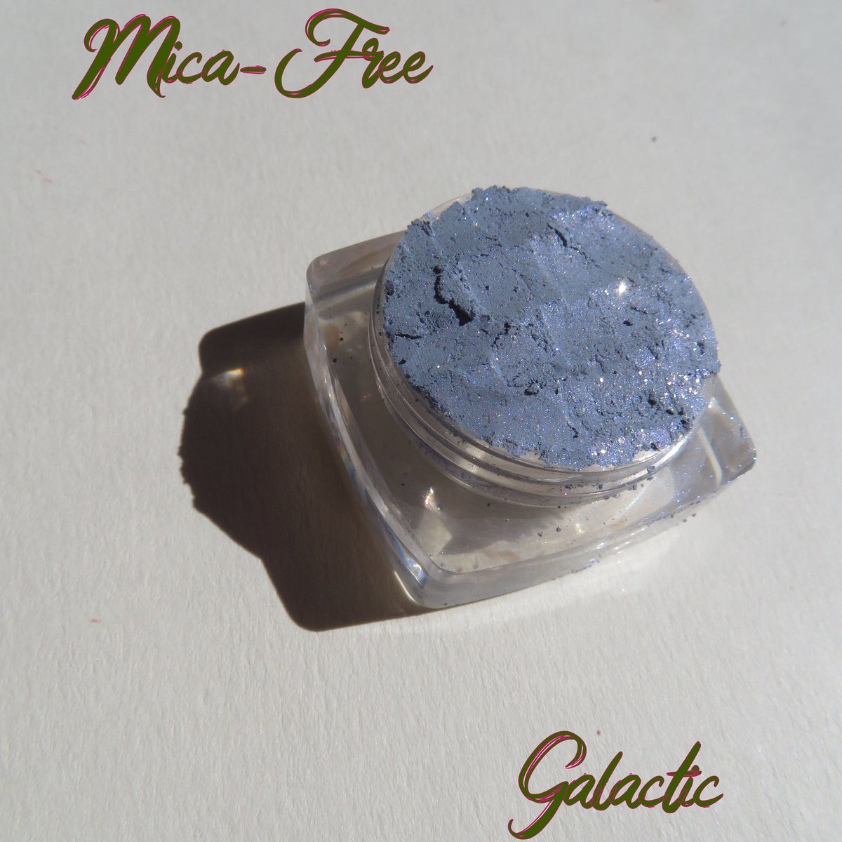 Galactic Blue Gray loose mineral eyeshadow with sparkling shimmer in a round jar, vegan and cruelty-free.