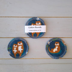 Cotton rounds with otter pattern, blue fabric, white stitching, by Creative Sisters of TX