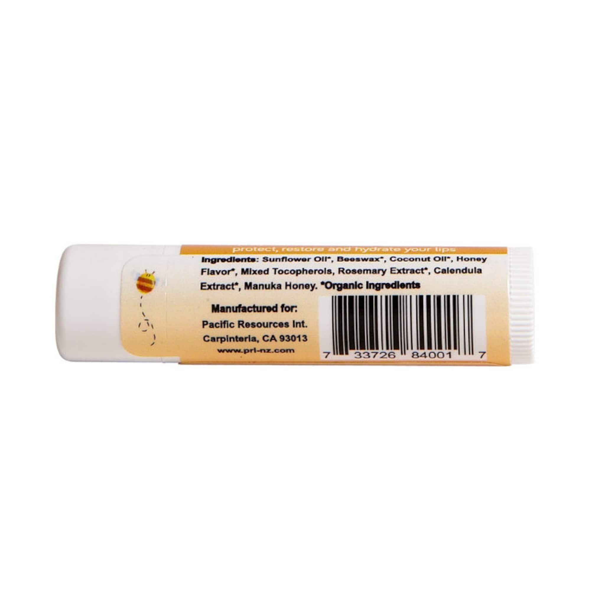 Lip balm tube with white and tan label, barcode, and text about ingredients