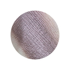 Close-up of vegan duochrome eye shadow pot showing blackened burgundy to plum brown metallic color shift
