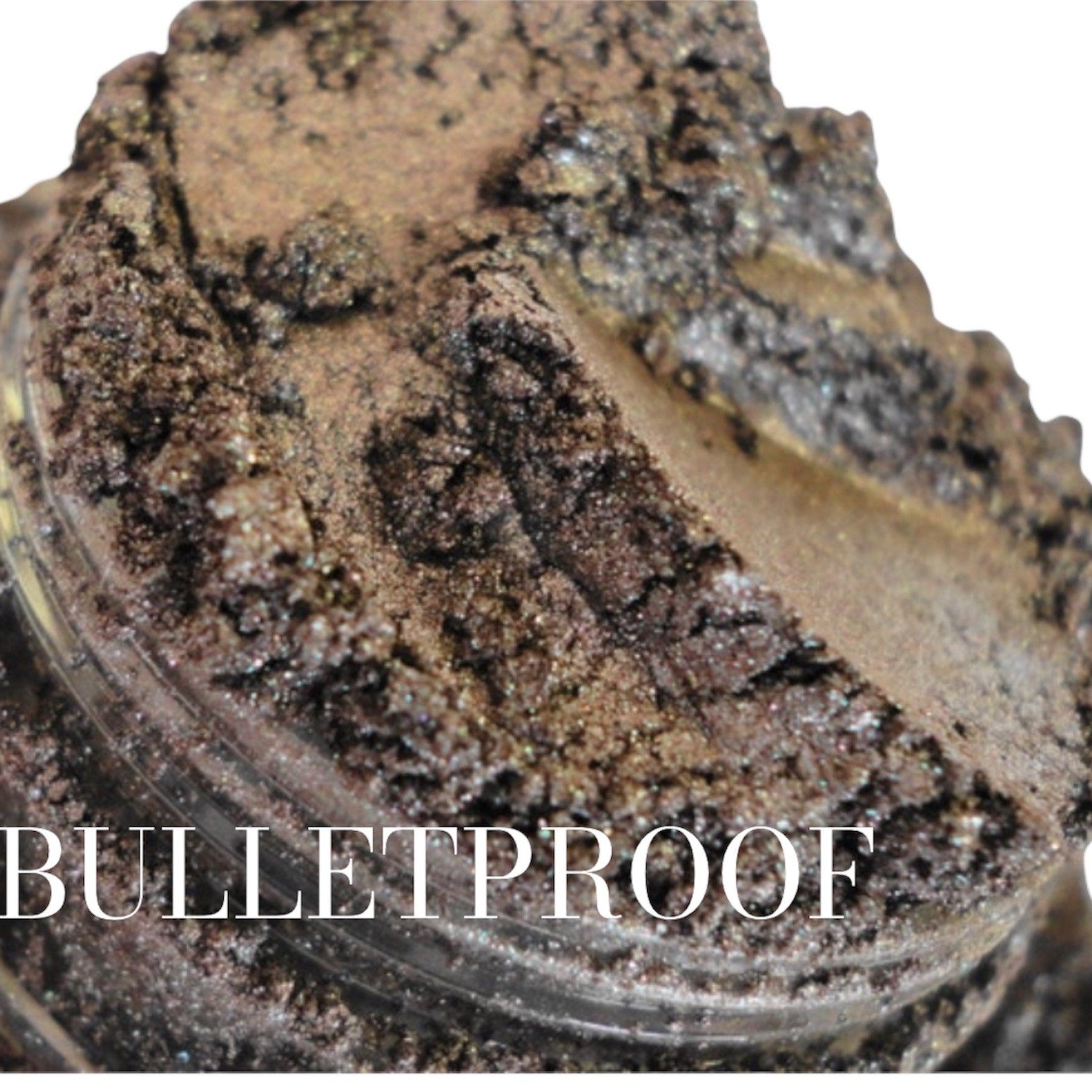 Dark brown shimmer eyeshadow in a round sifter jar with vegan mineral makeup label