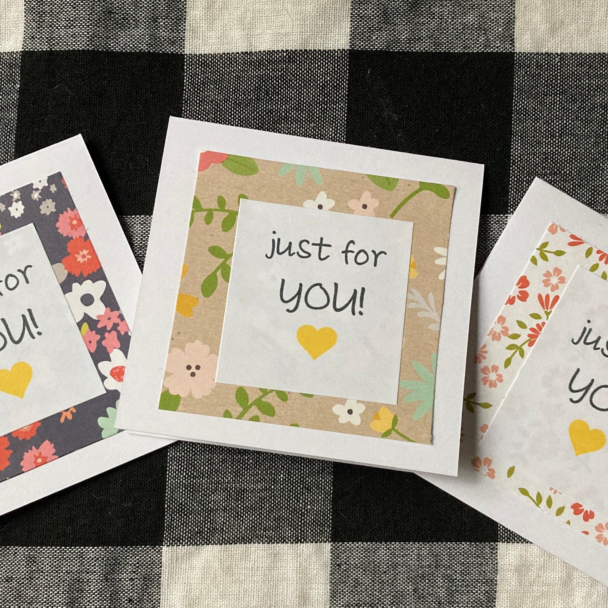Greeting cards with floral patterns and "just for you" message on white paper