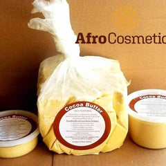Close-up of golden unrefined cocoa butter in glass jar with natural texture and organic label visible