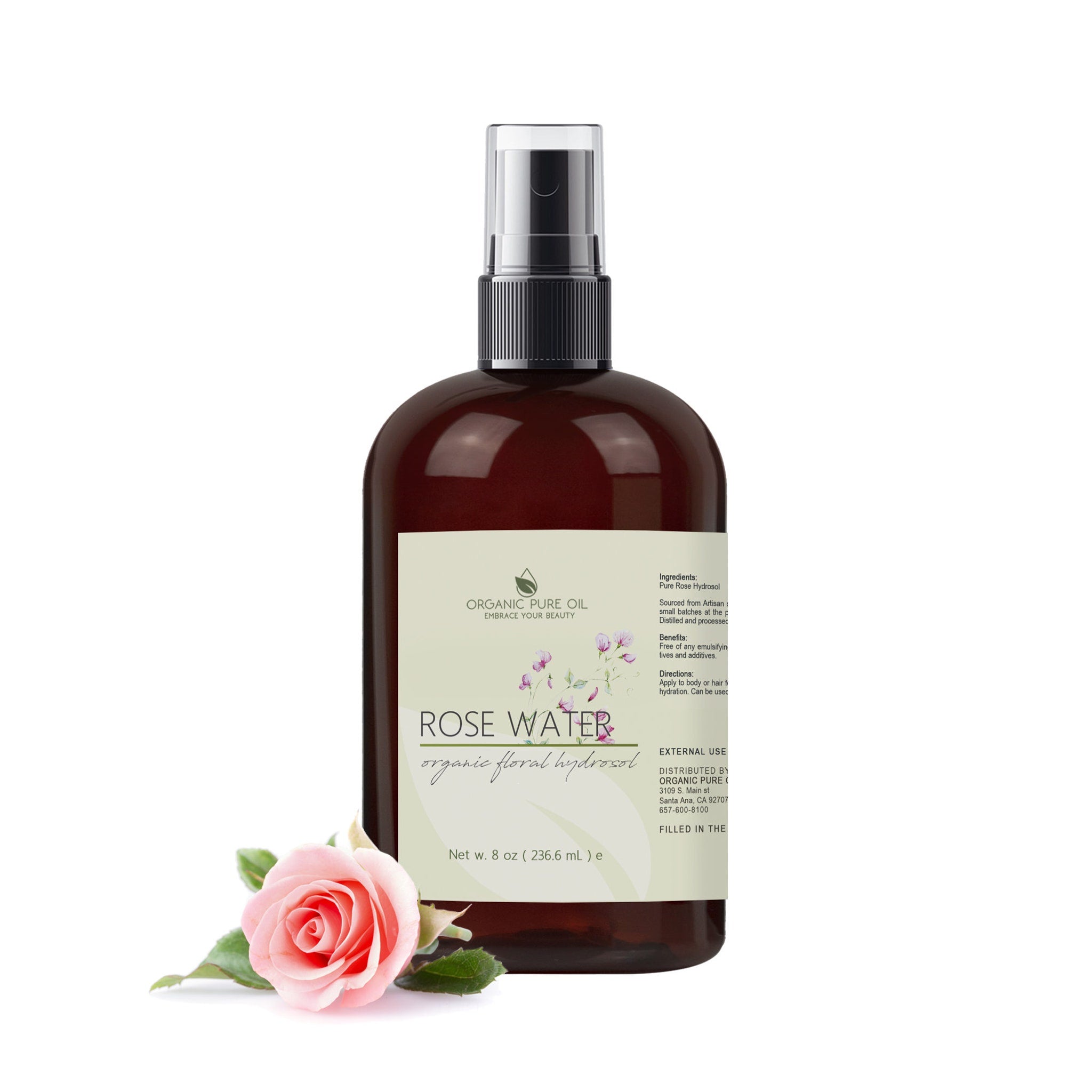 Rose water bottle with brown glass, black sprayer, and pink rose accent