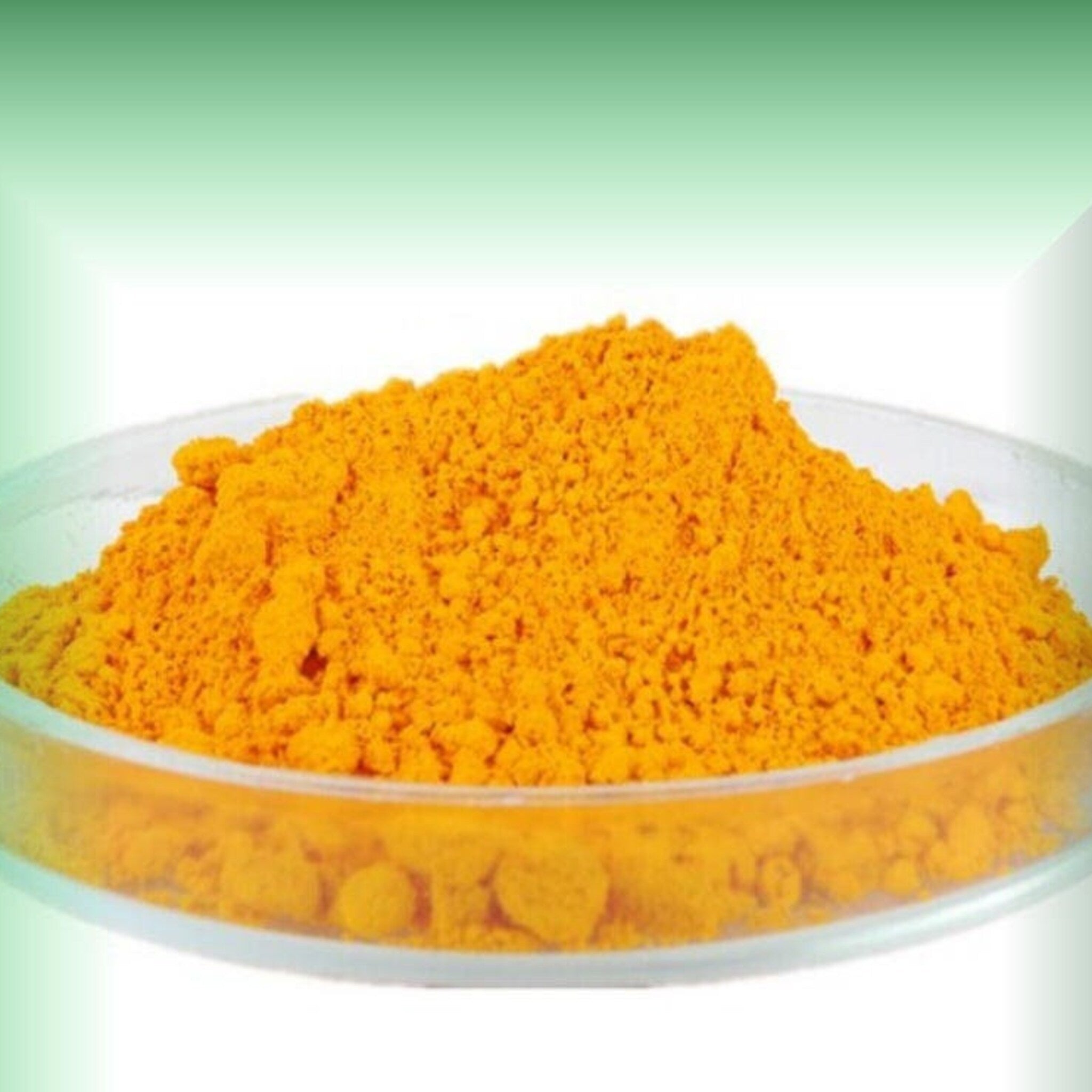 Coenzyme Q10 powder, bright yellow granular powder in a clear plastic dish
