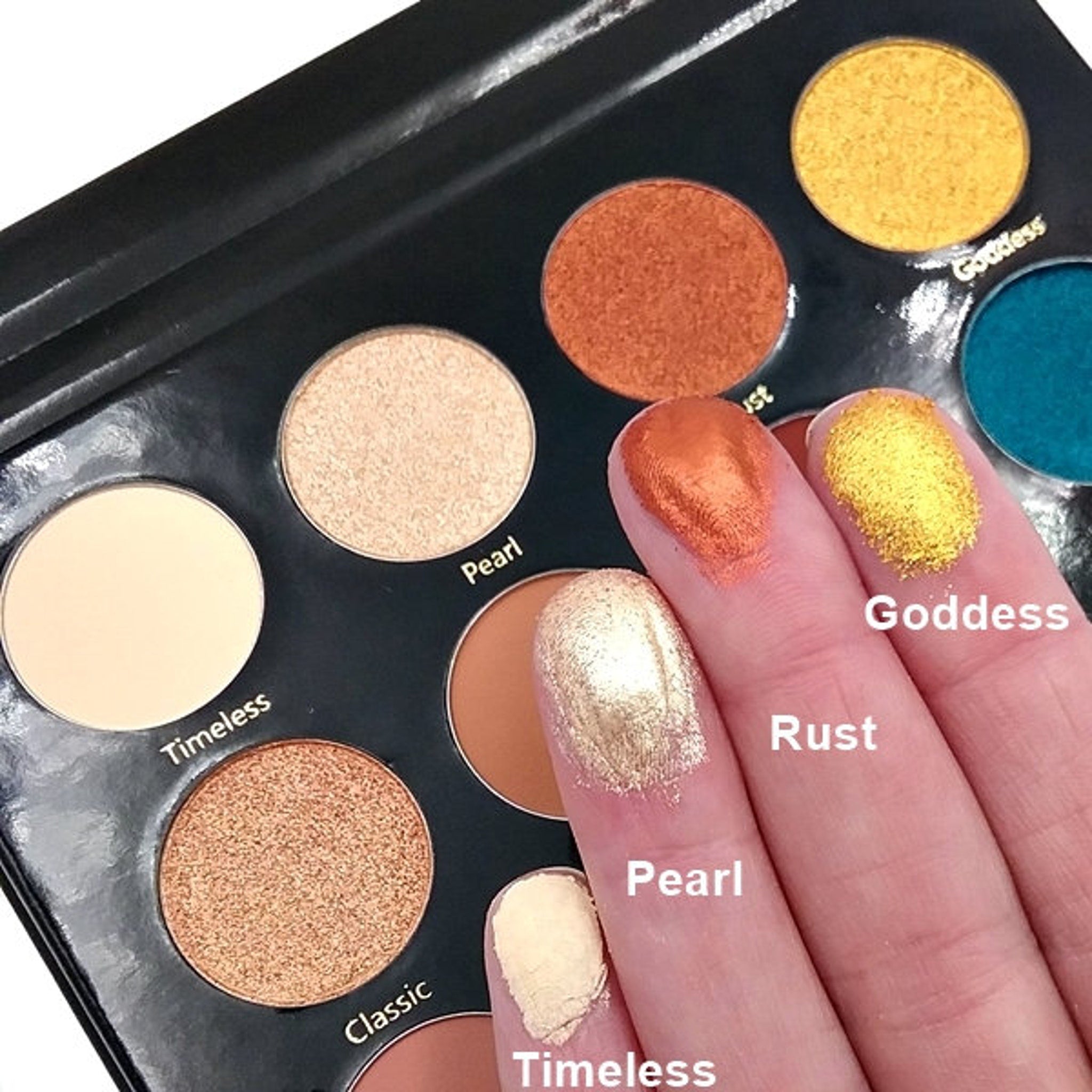 Side view of Day & Night Eyeshadow Palette showing slim compact case with gradient shades from light to dark