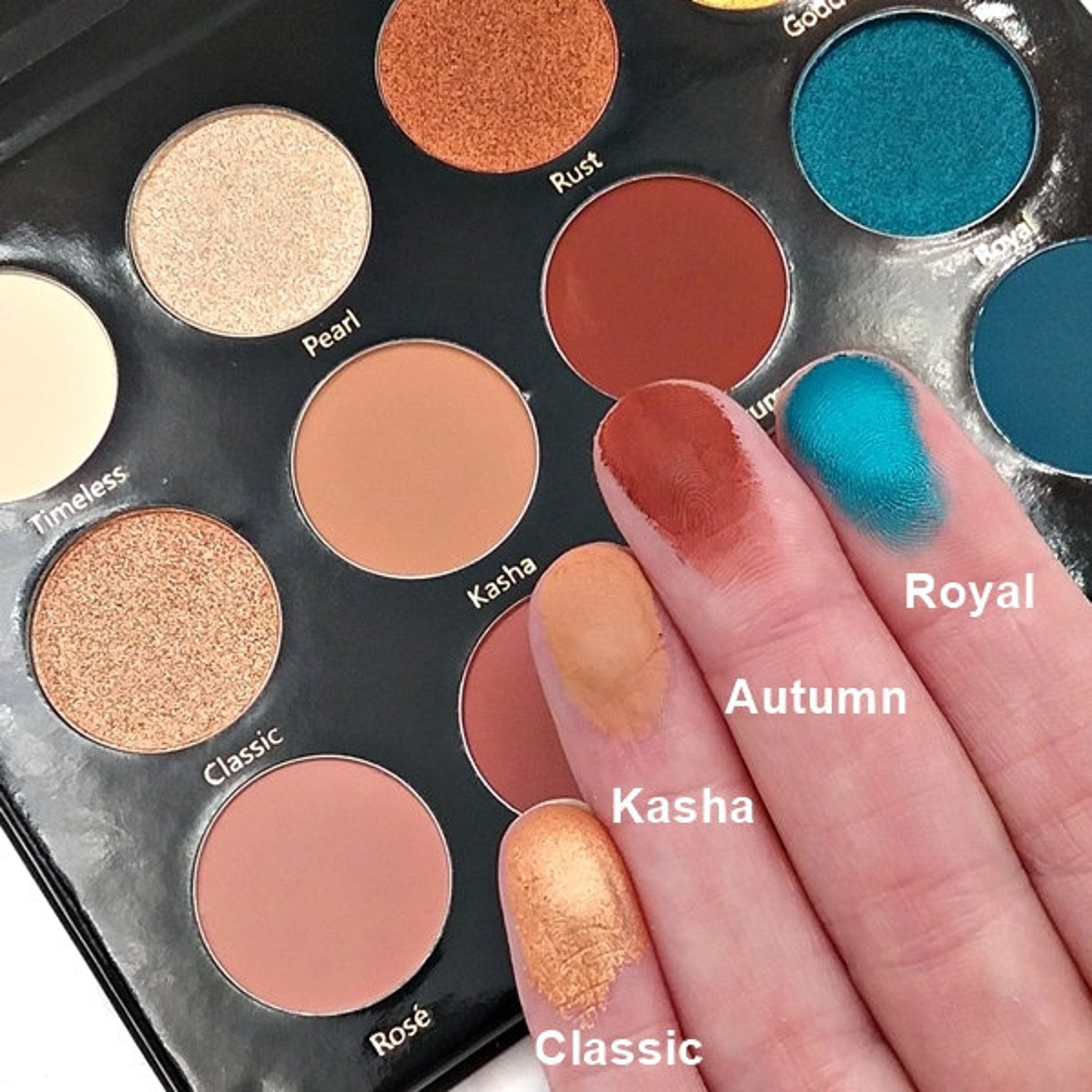 Day & Night Eyeshadow Palette open to reveal 12 shimmer and matte shades in warm neutrals and bold jewel tones
