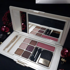 Side view of Merle Norman Luxiva compact showing six shimmering eyeshadows and two blushes in pink and bronze tones