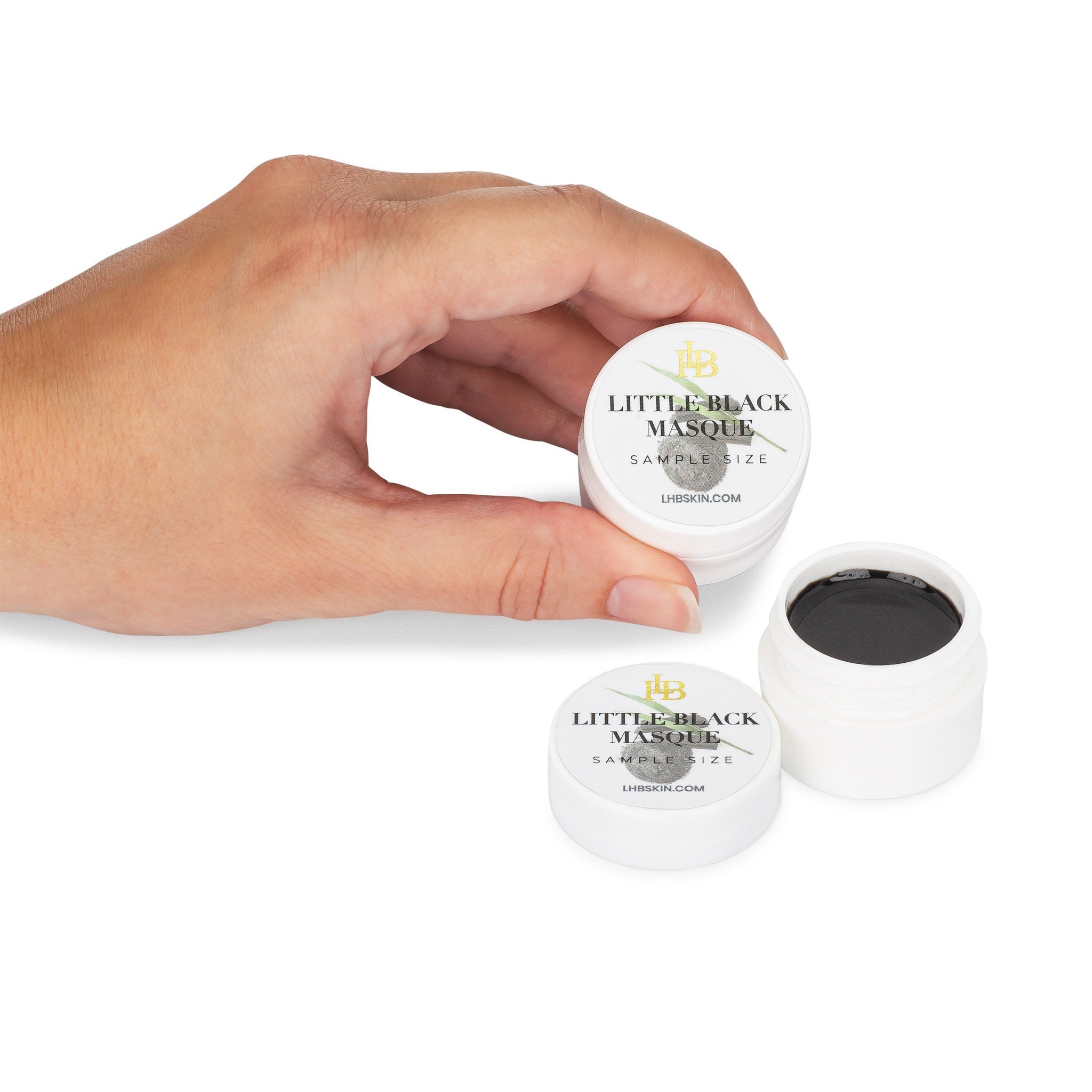 Black charcoal mask tube with sleek silver cap and matte finish, showcasing deep pore cleansing formula