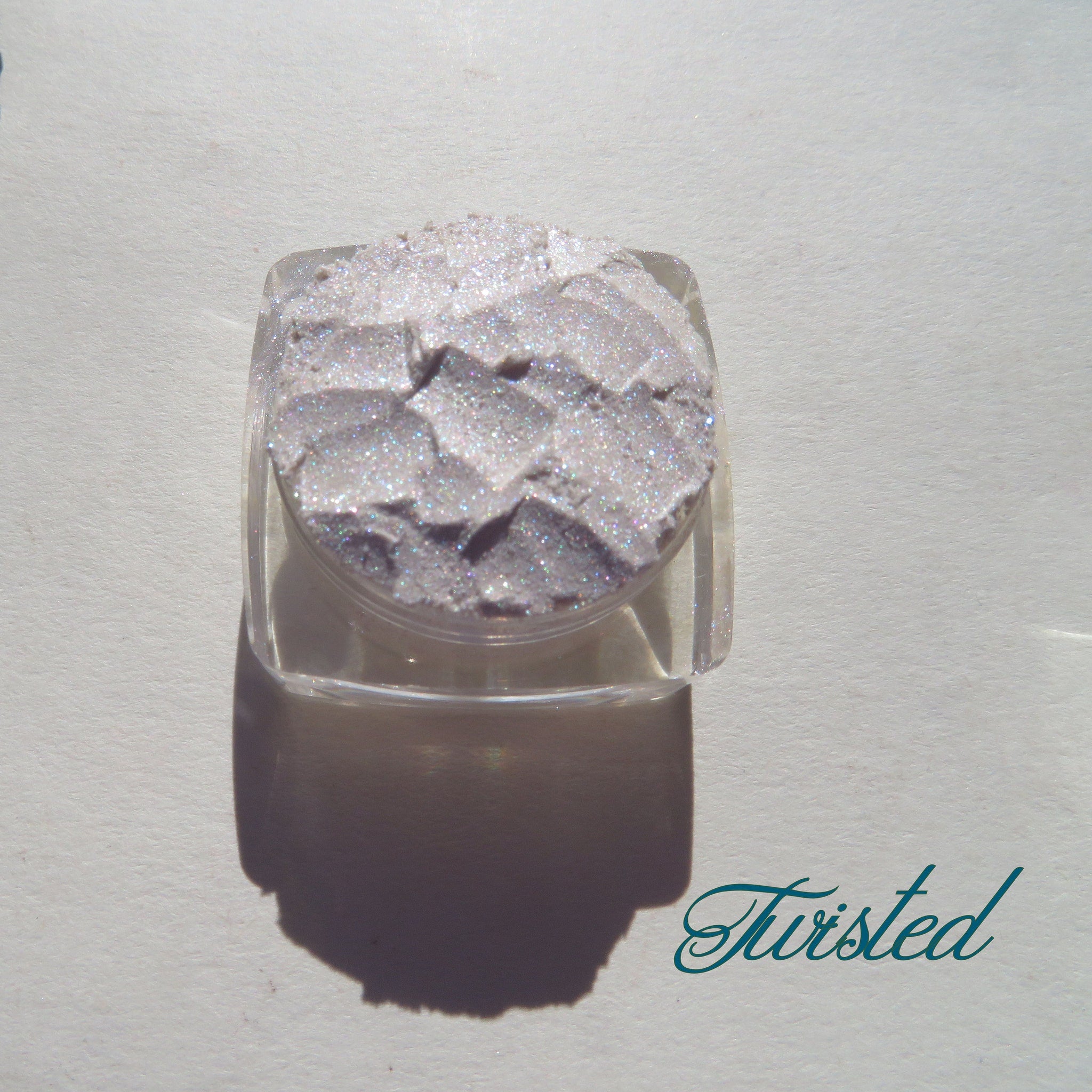 Loose eyeshadow pigment, sparkly silver, textured, in clear container, Twisted brand