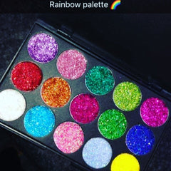 Side view of glitter eye shadow palette showing shimmering multicolor pigments in compact case