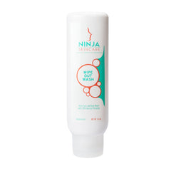Close-up of opaque white 10% benzoyl peroxide acne wash with foaming texture in a sleek blue squeeze tube