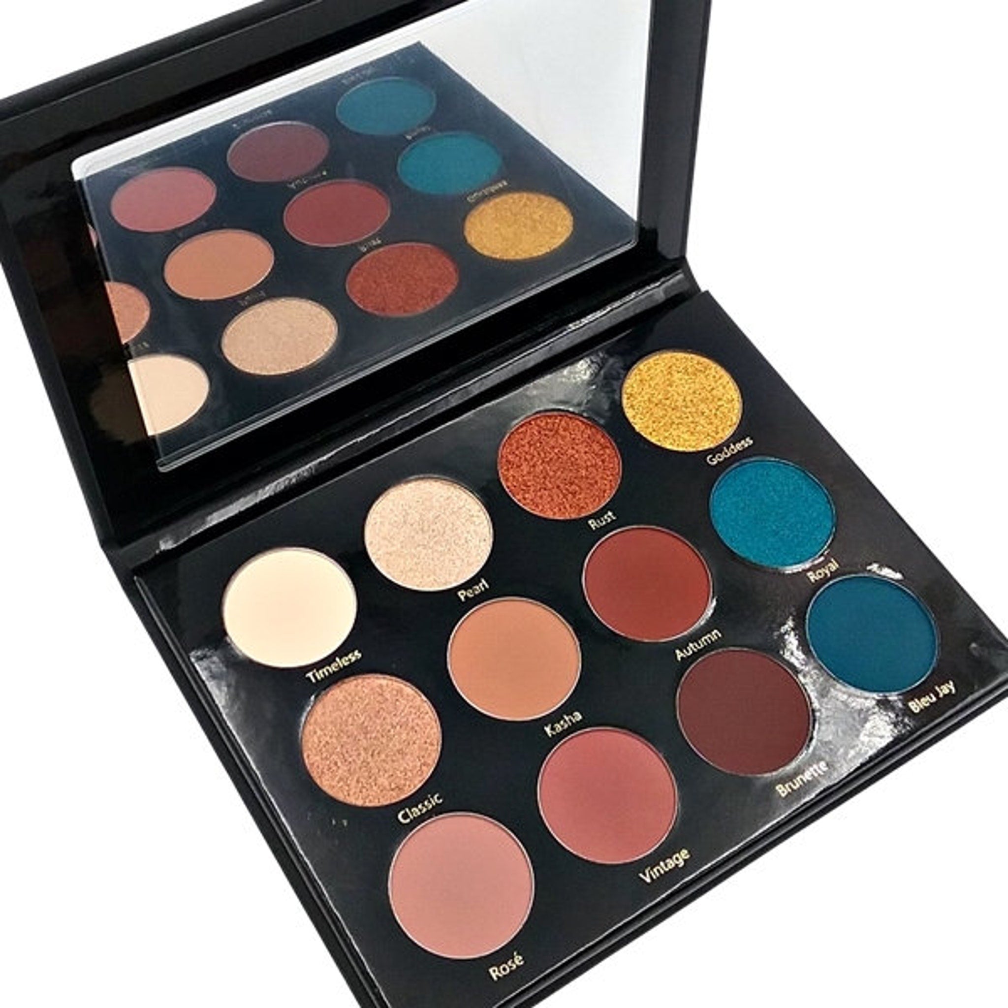 Open Day & Night Eyeshadow Palette showing matte and shimmer shades in warm neutrals and bold jewel tones