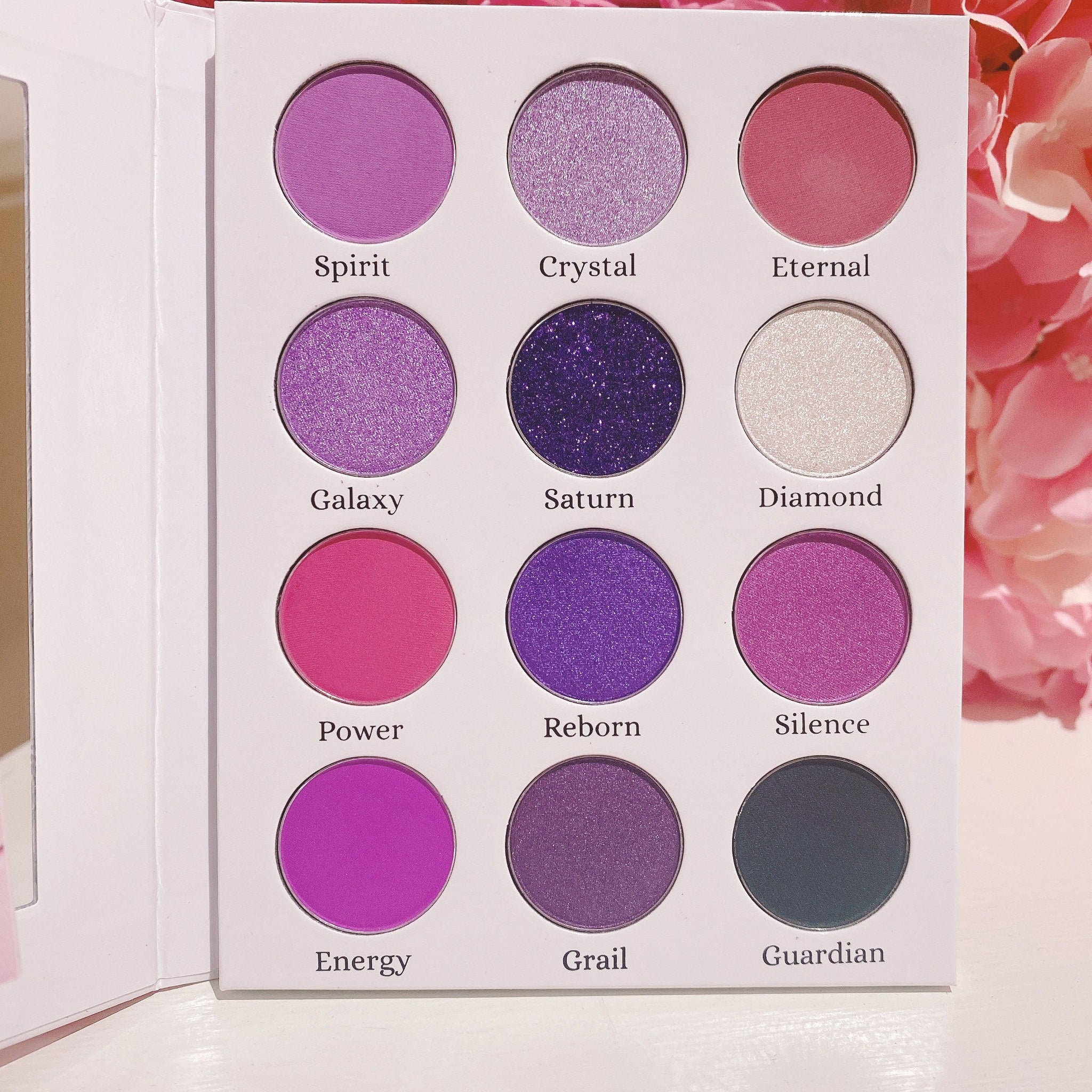 Close-up of bonus holographic sticker sheet included with the Kawaii Gothic purple eyeshadow palette