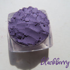 Side view of three purple shimmer loose pigment jars with vegan labels, showcasing sparkly texture