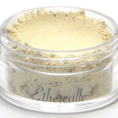 Side view of Buttercream Ivory White vegan mineral cream eyeshadow in compact with frosted finish and rounded edges