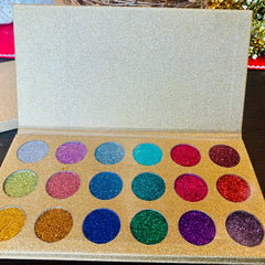 Eyeshadow palette with gold glitter case and various colorful glitter eyeshadows