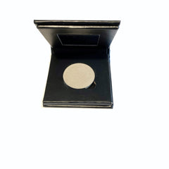 Close-up of platinum silver mineral eyeshadow compact showing shimmering metallic texture and smooth pressed powder finish