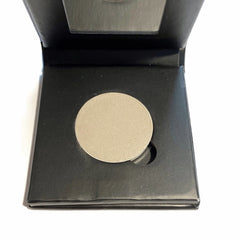 Platinum silver mineral eyeshadow compact with sleek mirrored case and shimmering powder pan
