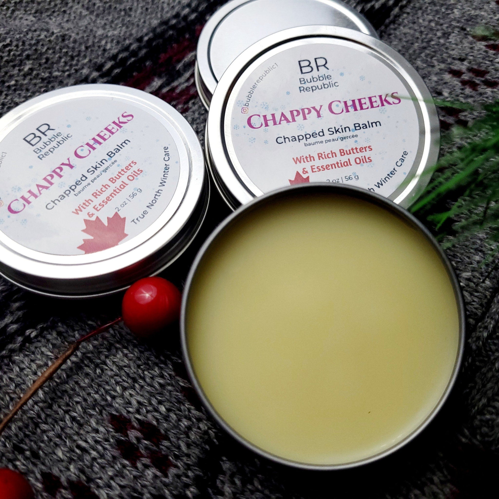 Chapped skin balm in silver tins with yellow balm and Bubble Republic branding on label