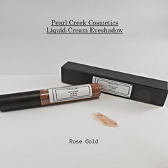 Two creamy eyeshadow pots in rose gold and nude shades with sleek metallic lids