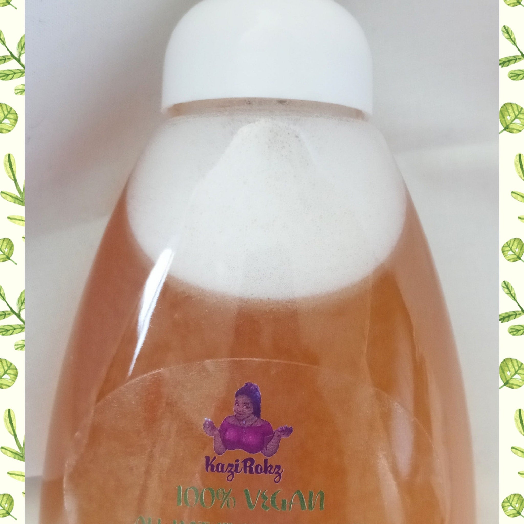 Bottle of liquid with white foam, orange liquid, and white cap, Kazi Rokz branding visible