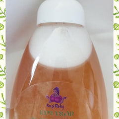 Bottle of liquid with white foam, orange liquid, and white cap, Kazi Rokz branding visible