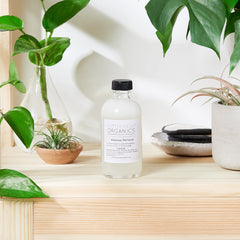 Makeup remover bottle with black cap and white label, Butter Me Up Organics brand