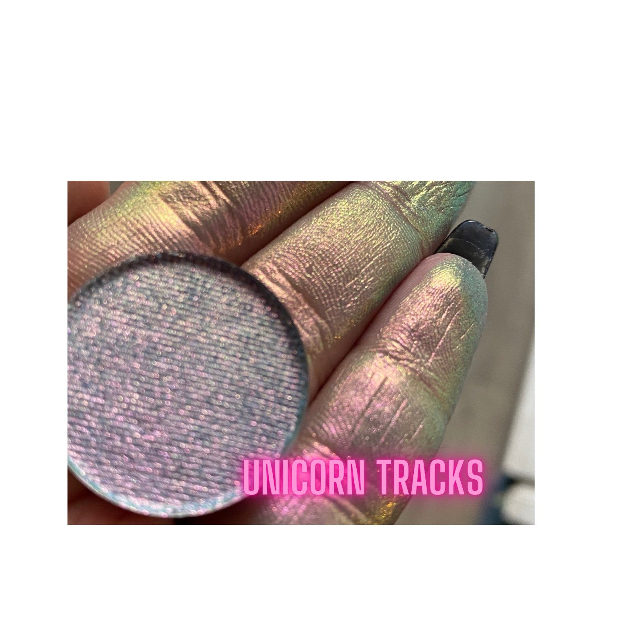Extreme close-up of multichrome unicorn tracks eyeshadow showing shifting blue-purple-green iridescent pigments