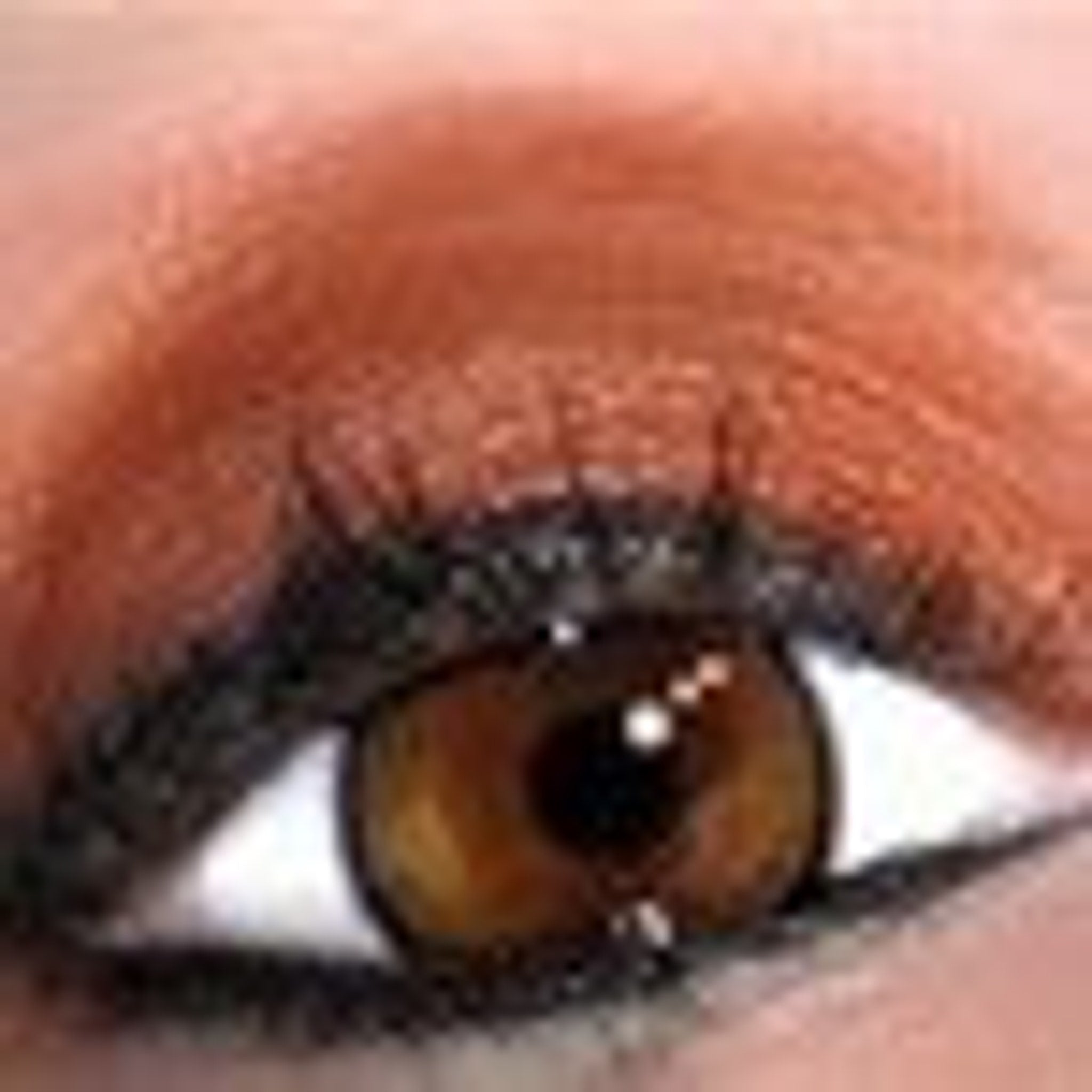 Close-up of creamy nude eye shadow primer with smooth texture in sleek black tube