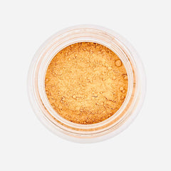 Face powder in light brown color, in a clear plastic container, product view from above