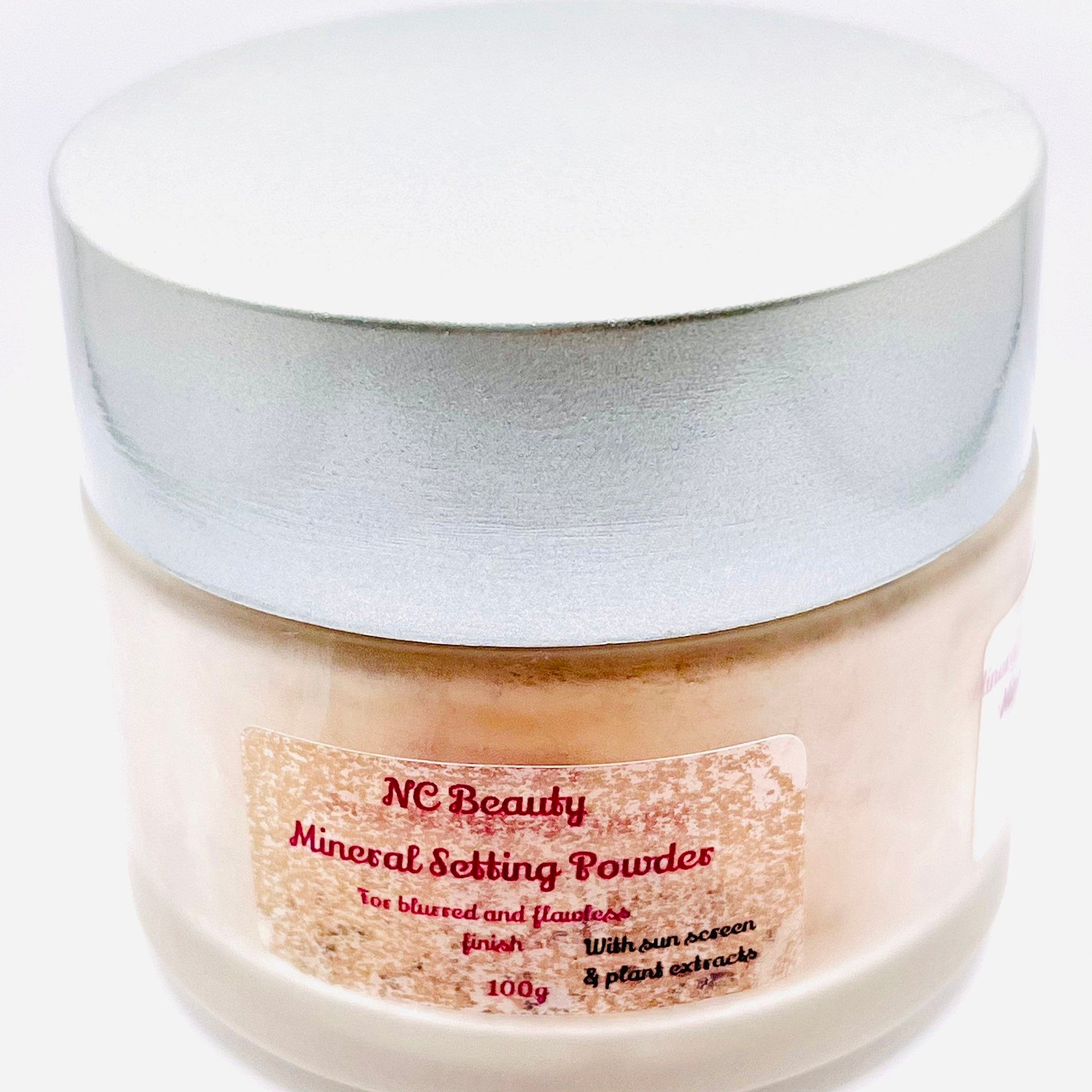 Mineral setting powder jar with silver lid, beige powder, and NC Beauty label
