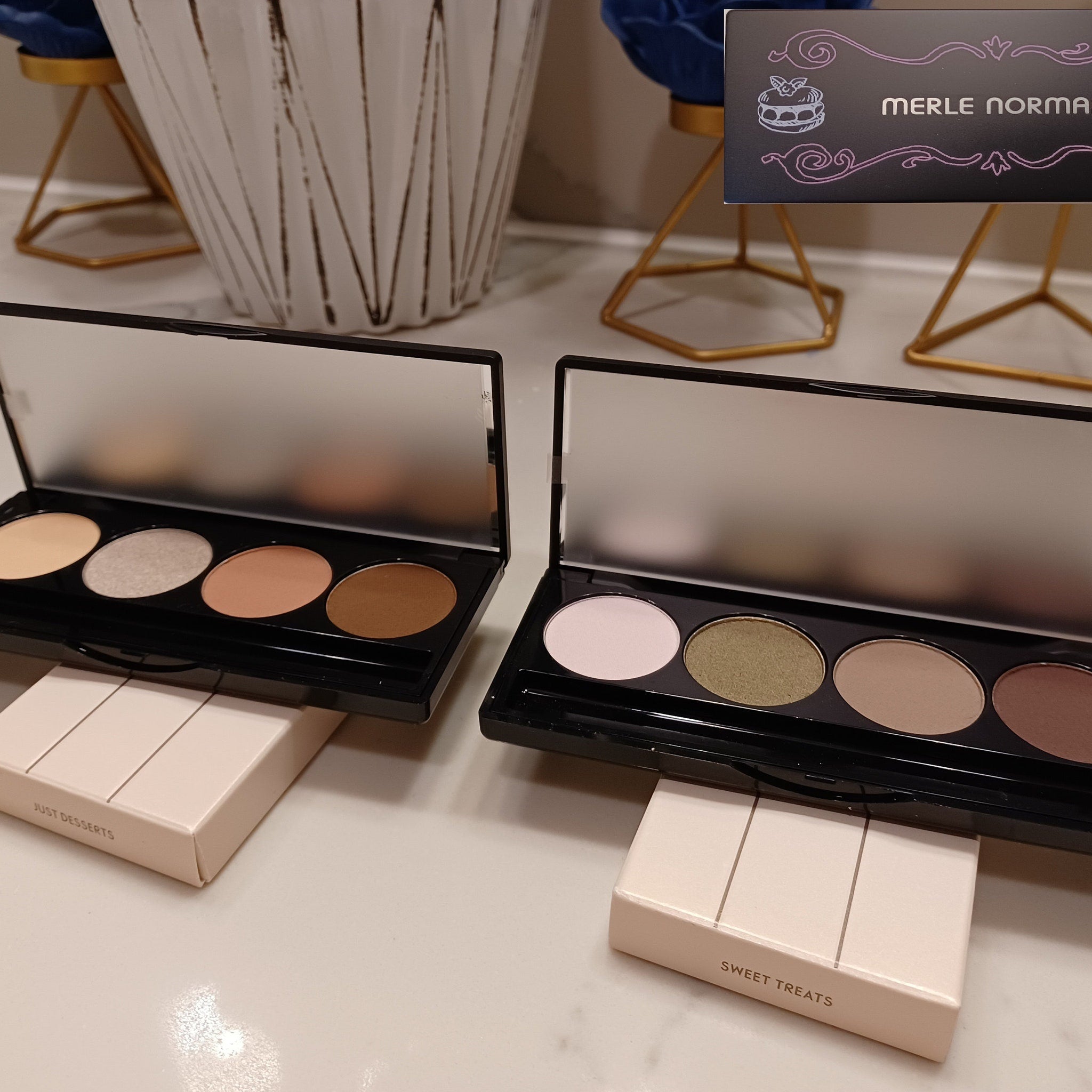 Side view of Merle Norman Eye Color Quad showing four complementary powder shadows in a sleek black compact