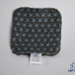 Black patterned fabric with blue accents and gray trim, Loup Indigo label visible