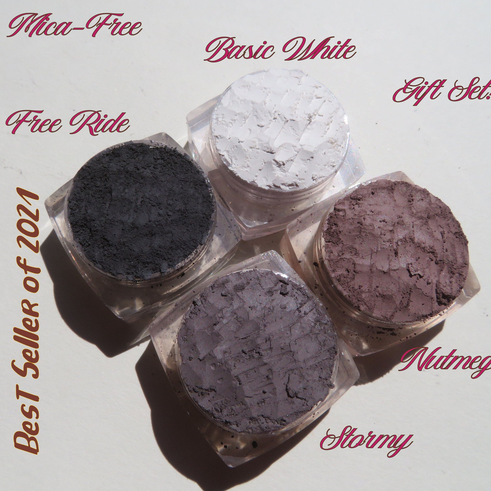 Four loose mineral eyeshadows in eco-friendly packaging with vegan formula cards for gifting