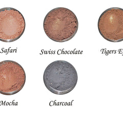 Close-up of warm brown and orange eye shadows with smooth matte finish in compact palette