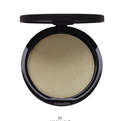 Side view of shimmering highlighter powder in compact palette showcasing gradient color shift