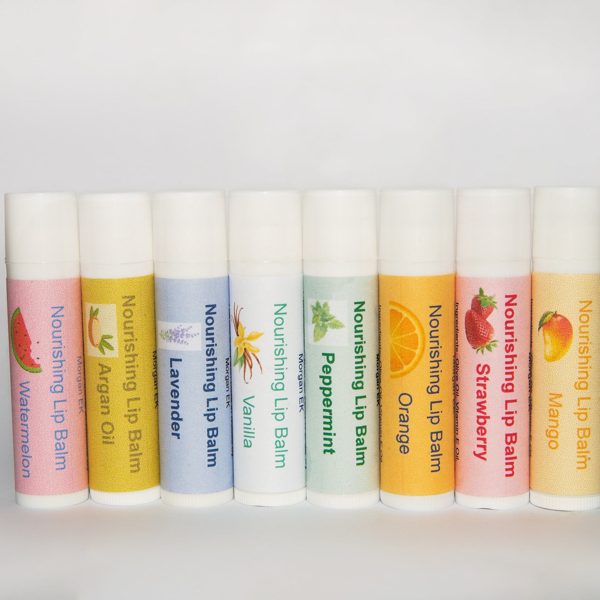 Lip balms with assorted colors, MorganEK brand name, and fruit illustrations on labels