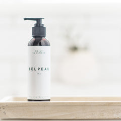 Daily cleanser bottle, brown glass and black pump, with Belpeau label on white background