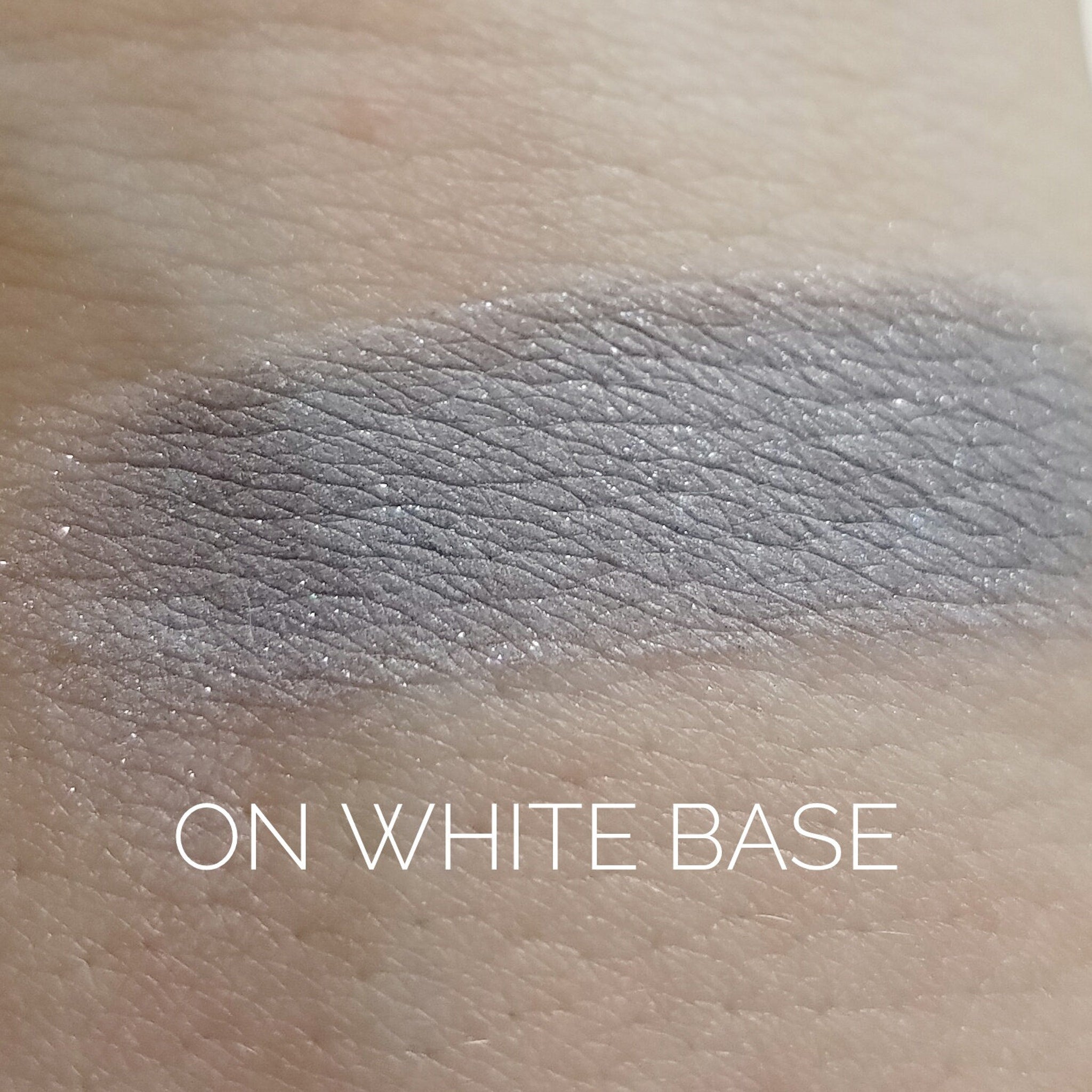 Close-up of Ghost Eye Shadow pan showing smooth matte finish and cool-toned lavender pigment
