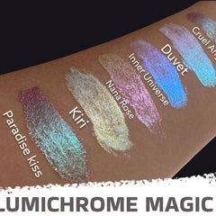 Close-up of fingertips applying shimmery duochrome liquid eyeshadow in shifting violet-blue hue