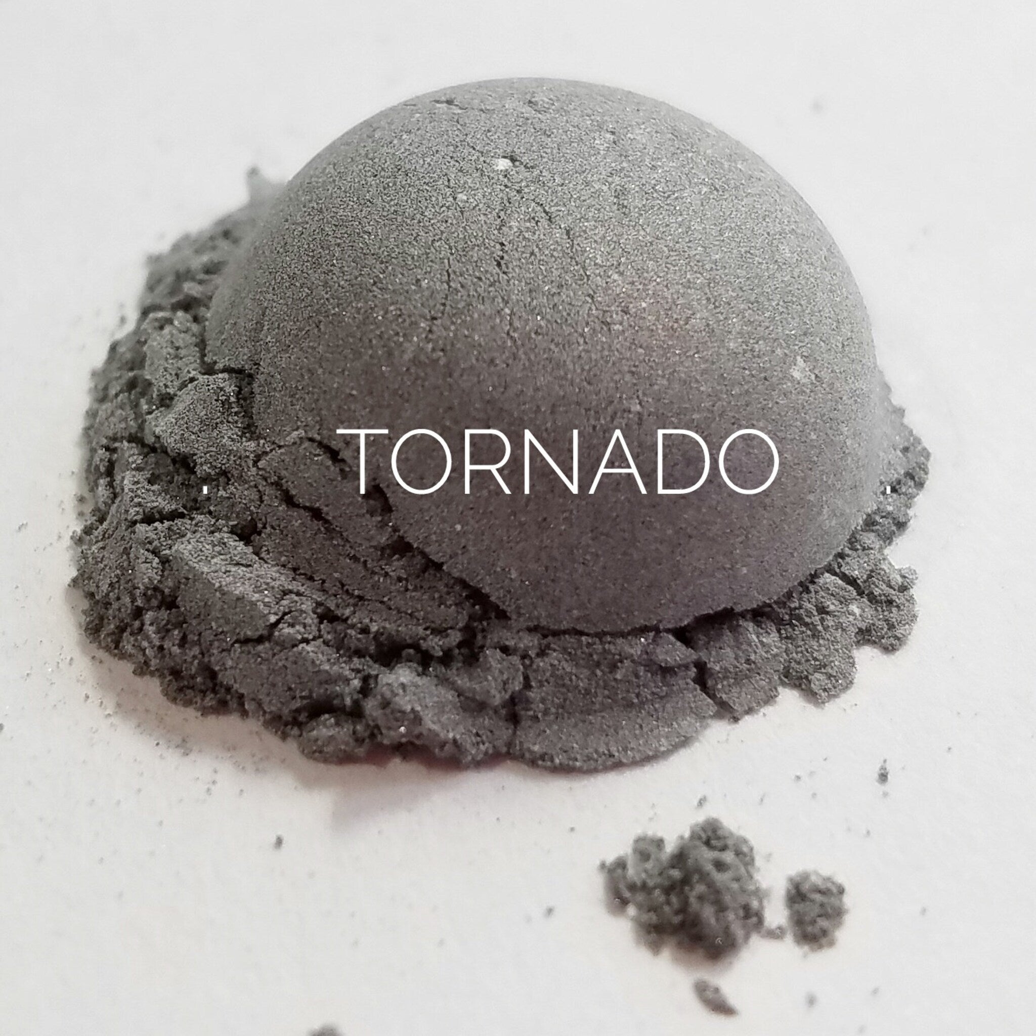 Close-up of Tornado Eye Shadow palette showing vibrant matte and shimmer powder textures in bold shades