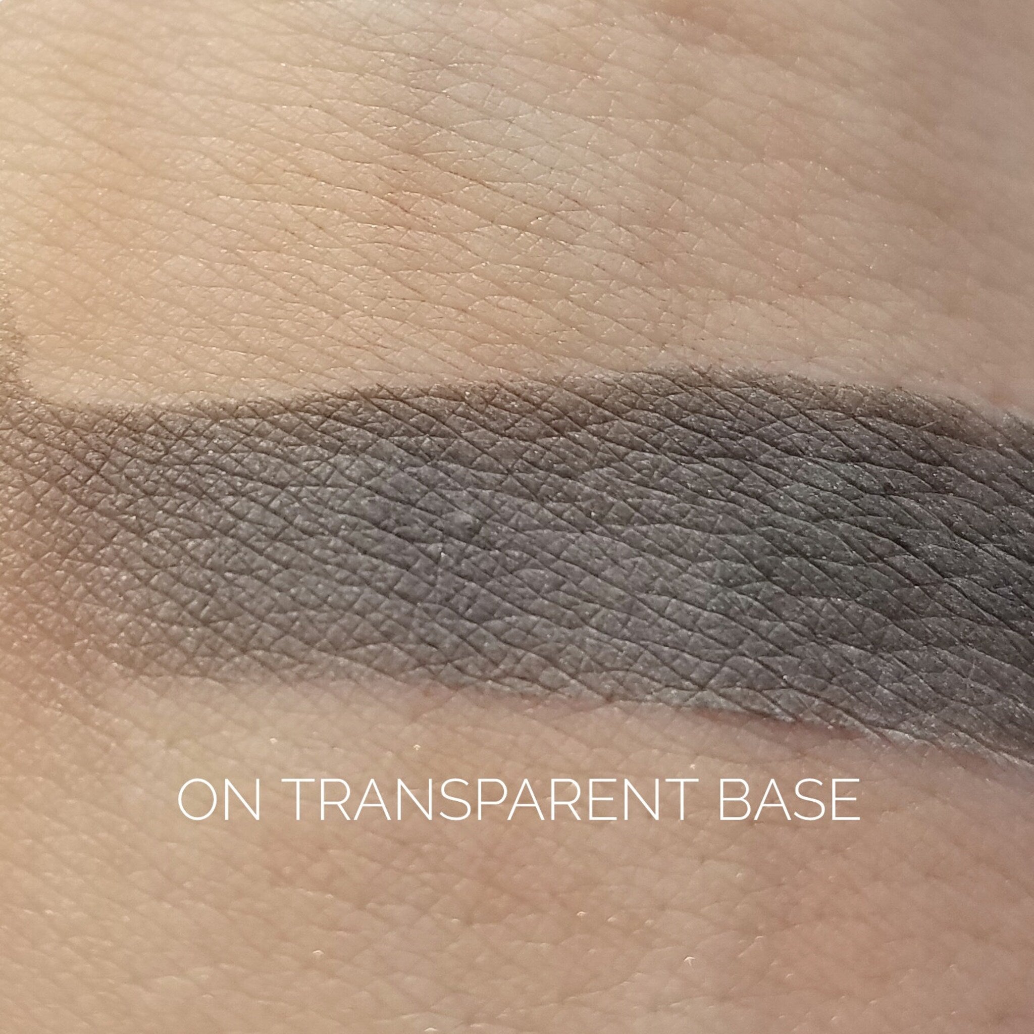 Close-up of fingertips applying shimmery Tornado Eye Shadow in a sweeping motion across eyelid