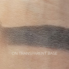 Close-up of fingertips applying shimmery Tornado Eye Shadow in a sweeping motion across eyelid